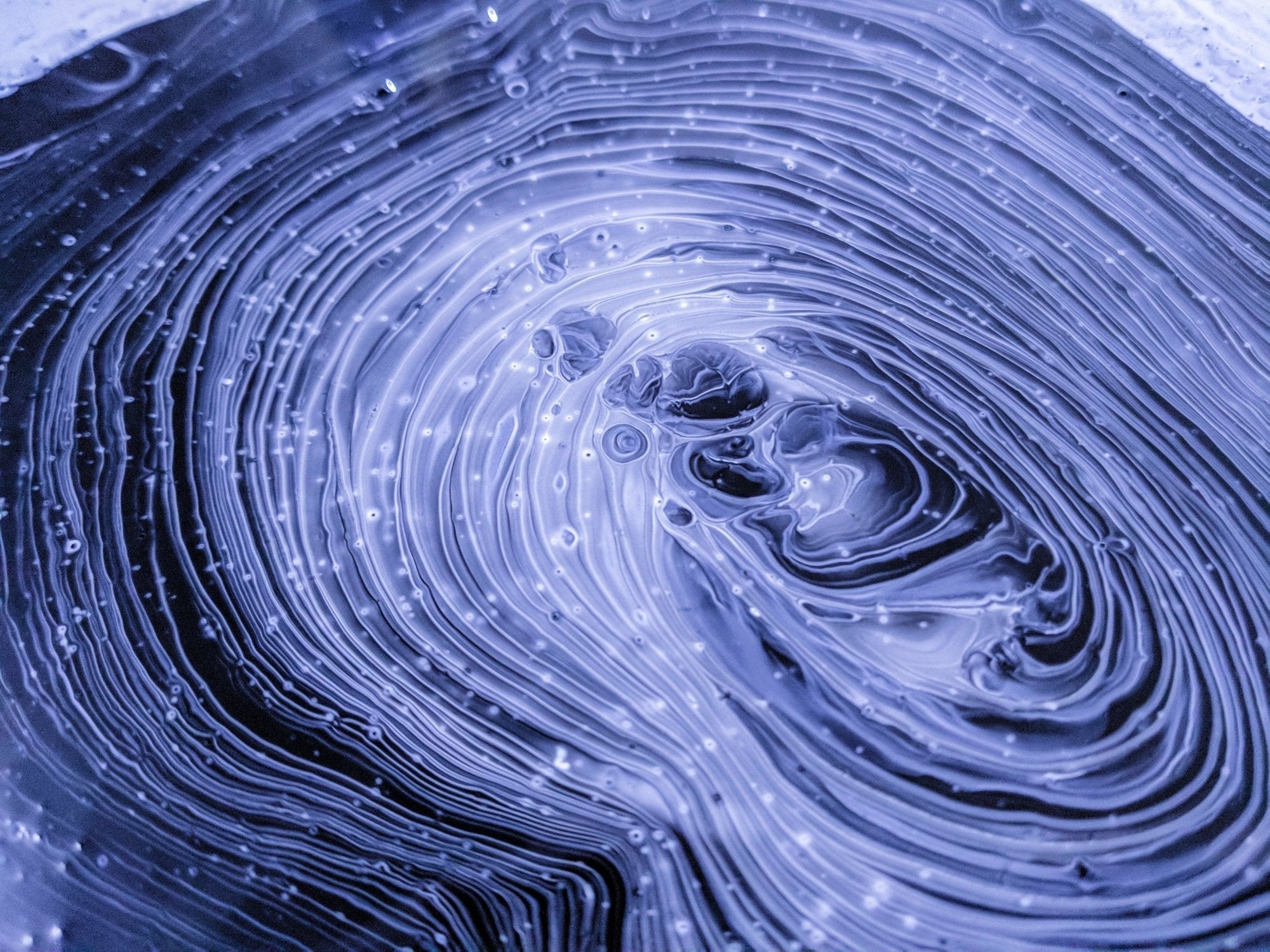 Abstract swirling blue pattern representing free radical oxidative stress